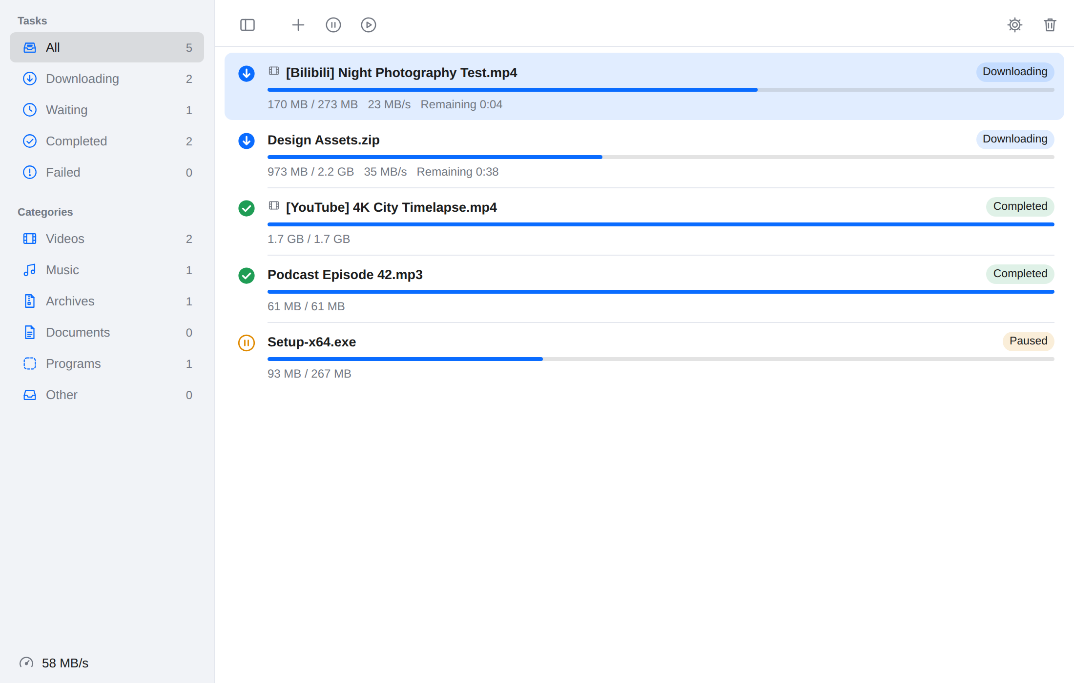 TurboGet task list showing download progress, categories, and paused tasks